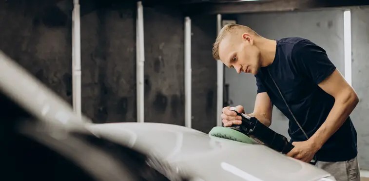 Man waxing car